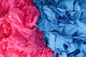 Obraz premium Pink and blue latex sterile medical gloves as a background.