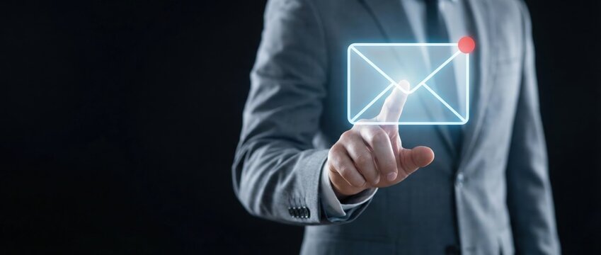 Business professional engaging with virtual email interface modern office space digital interaction dark environment close-up viewpoint communication concept