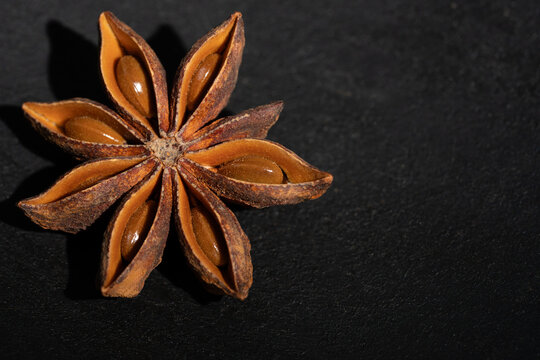 Close-up of star anise on a dark surface 