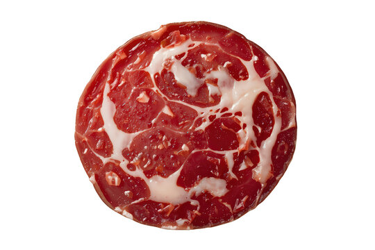 Round slice of italian dry-cured pork meat with marbling fat, a charcuterie delicacy, on transparent background