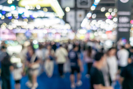 Blurred Crowd of People at Exhibition Hall with Colorful Bokeh Lights