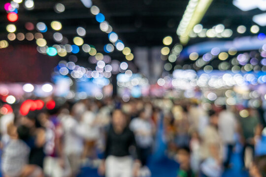 Blurred Crowd of People at Exhibition Hall with Colorful Bokeh Lights