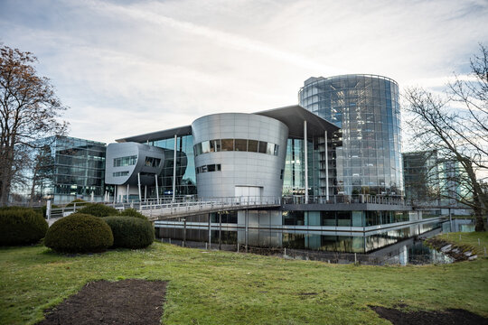 DRESDEN, GERMANY - 5. April 2026: Die Gl&auml;serne Manufaktur (Transparent Factory) building exterior. Manufacturing building entrance of the Volkswagen company. Modern architecture within the city.