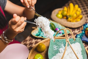 Traditional Thai rice noodles served with fork and spoon, authentic Asian food and cultural dining experience