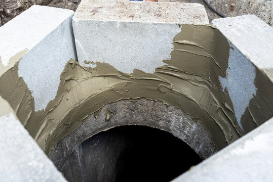 Septic tank manhole construction gluing concrete blocks