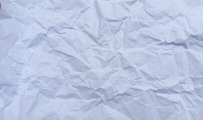 Fototapeta premium Textured surface of crumpled white paper offering a unique tactile visual experience with light and shadow