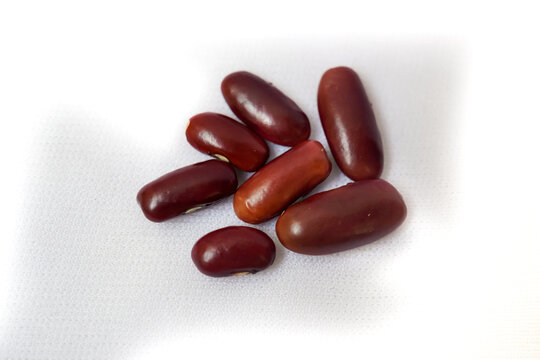 Macro Close-up of Organic Rajma, (Laal Lobia ) or red kidney beans dal cleaned on a white background. Top view