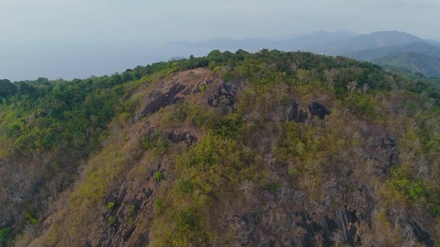 Majestic mountains Black Rock top with green and golden brown foliage stretch under a clear blue sky
