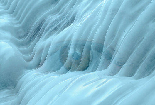 Macro close-up of a beautiful girl eye surrounded by frost and ice crystals during cold winter weather