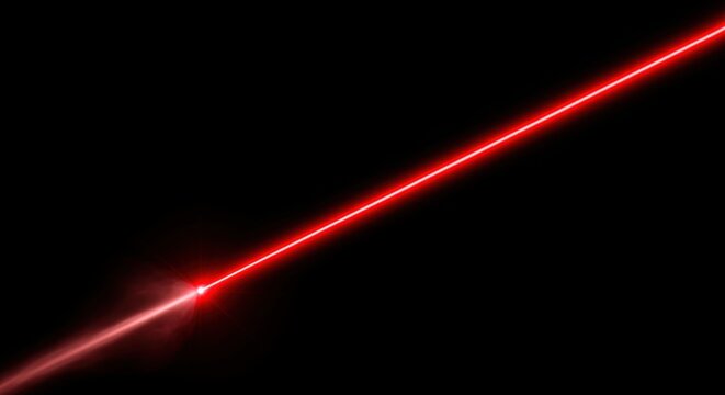 A bright red laser beam cutting diagonally across a black background, emitting a glowing light effect.