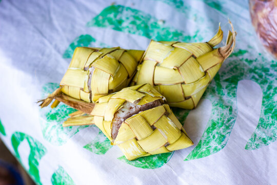 Freshly cooked Filipino puso rice, wrapped in coconut leaves. Puso, or hanging rice, is a traditional Filipino delicacy from Cebu and the Visayas region