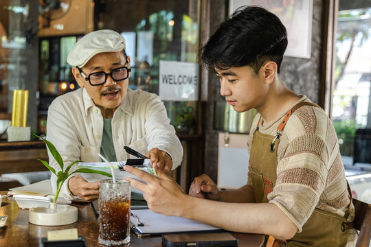 Small business, cafe, tablet, planning, owner and staff working together on digital system to manage orders and workflow, improving coordination family business father and son, operation efficiency