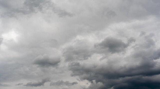 Timelapse preview of heavy gray storm clouds drifting across an overcast sky, creating a moody and dramatic weather scene.