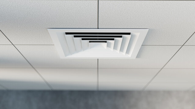 HVAC ventilation, air distribution. Ceiling diffuser installed in suspended office ceiling provides airflow circulation and climate control inside commercial building interior.