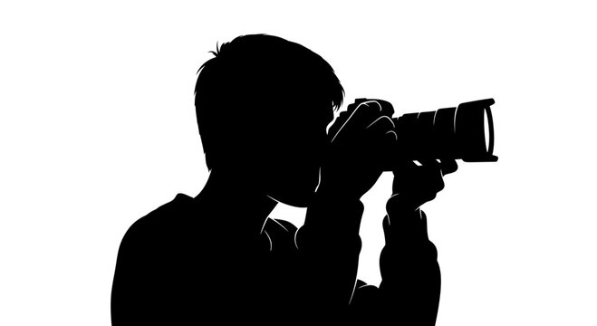 Silhouette of man holding camera.