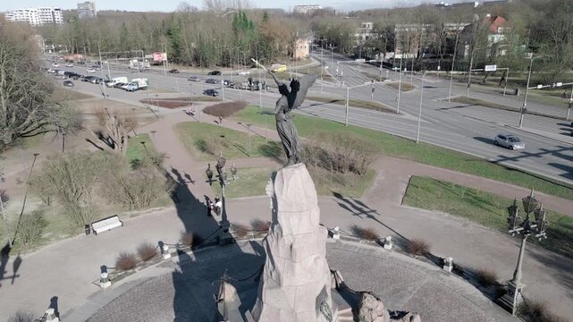 Aerial view of Russalka Memorial statue near beach promenade in Tallinn Estonia with sea background