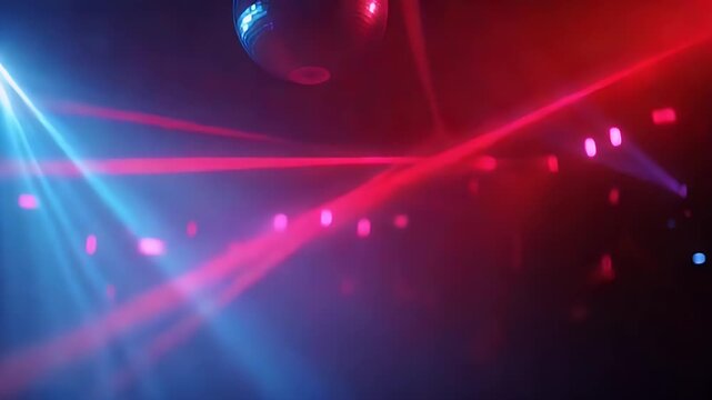 Red laser beams cutting through thick fog create dynamic lighting patterns during night event with disco ball reflection while blue stage lights strobe in background for energetic atmosphere.
