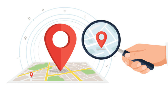Red location pin on a map with a magnifying glass held by a hand highlighting a specific area for navigation purposes.