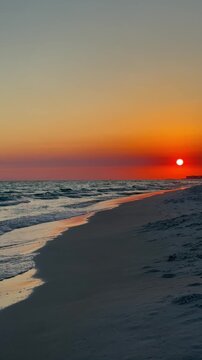 Big golden sun setting over the Gulf of Mexico Destin, Florida 