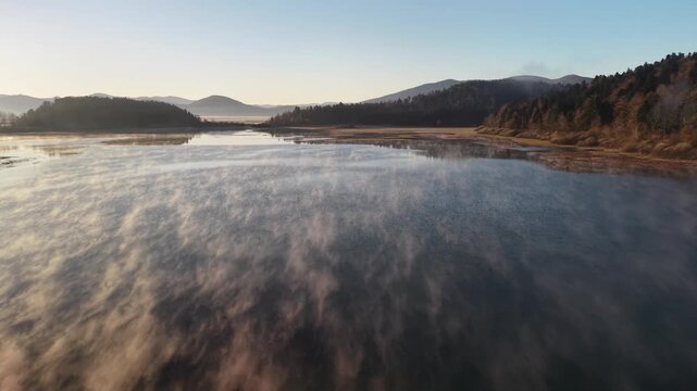 Mystical morning mist over Lake Cerknica at sunrise, Slovenia &ndash; aerial view