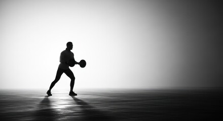 Fototapeta premium Man playing basketball in dark room.