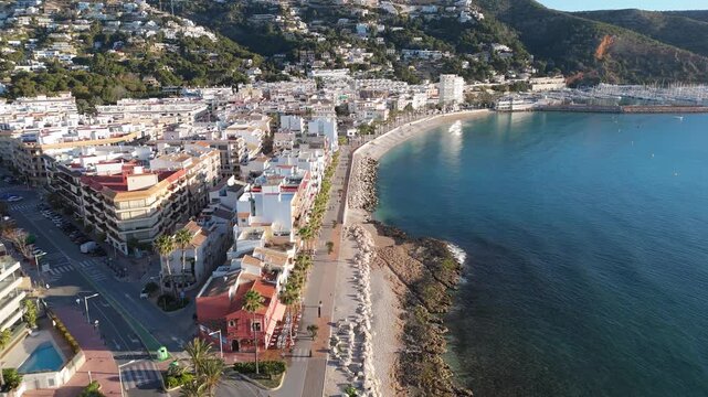 Drone flying above javea town coastline in alicante spain