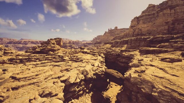 wide route overview across rocky expanse with marked terraces and distant cliffs, composition suggests pathfinding and navigation for hikers or offgrid