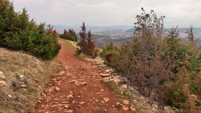 Traveler hiking to Uvac canyon viewpoint Serbia outdoor adventure journey