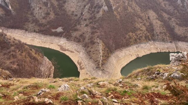 Man looking at Uvac River canyon Serbia scenic viewpoint travel destination
