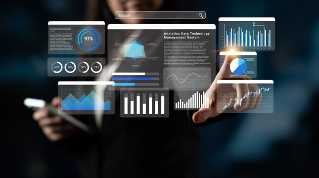 A woman engages with a digital dashboard displaying various data analysis tools, emphasizing technology and innovation in a professional workspace environment. Ledger