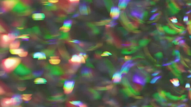 Art kaleidoscope. Colorful light. Defocused purple green pink round reflection gleam bright texture leak on abstract dazzle background.