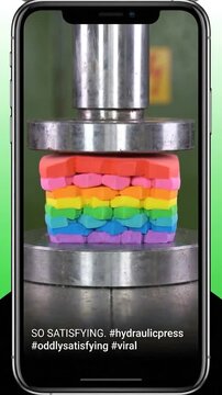 Colorful clay gets squished under heavy hydraulic press machine