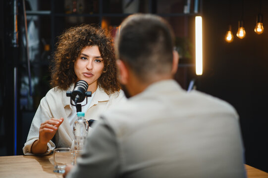 Content creators recording podcast in modern studio