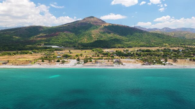 Scenic Panorama Drone Aerial Video of the crystal clear water and the beach and Mount Katung-uhan in Botolan, Zambales in the Philippines