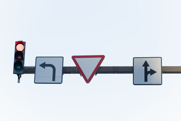 Urban intersection traffic control system with reflective lane guidance signs and red stop light...