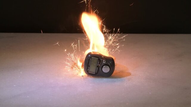 The electronic pedometer sparks and lights up due to a fault, creating a hazardous situation
