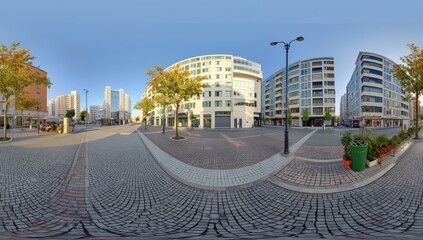 Fototapeta premium 360-degree HDRI panorama of a square in a residential area featuring tall buildings and urban development in equirectangular format for AR and VR.