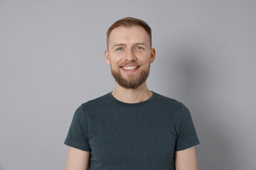 Obraz premium Portrait of handsome man on light grey background
