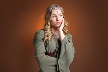 Obraz premium Beautiful elf girl on brown gradient background