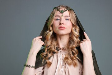 Obraz premium Portrait of beautiful elf girl on grey background