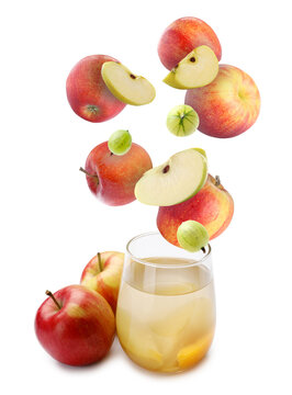 Tasty fruit compot in glass and falling ingredients on white background
