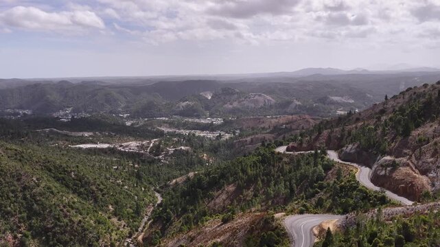 Lyell highway winding through the mountains at Queenstown in Tasmania &ndash; aerial view.