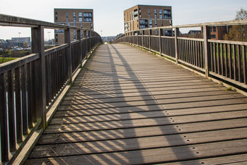 Fototapeta premium The Cuningar Loop Pedestrian Footbridge is a 99-meter-long spanning the River Clyde in Glasgow, Scotland, UK. Connecting the former Commonwealth Games Athletes' Village to Cuningar Loop Woodland Park.