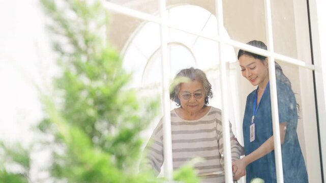 Caregiver assisting senior woman using walker at home, elderly mobility support and rehabilitation care, nursing service, physical therapy and recovery, helping improve independence and daily movement