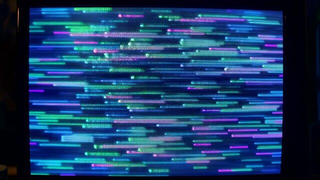 This shows a display screen with a chaotic error message and colorful glitchy lines on a dark background, illustrating technical difficulties and system failure.