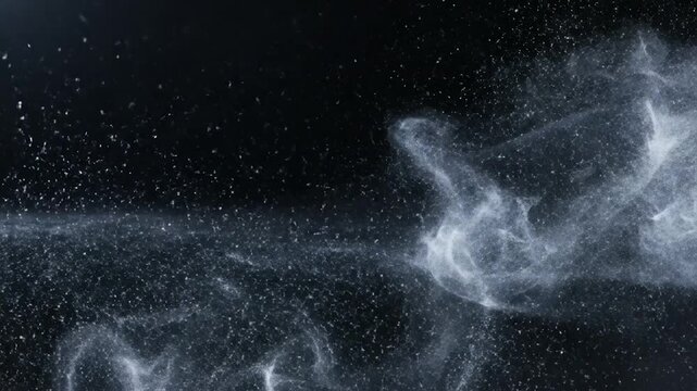 Abstract glowing light trails and particles in dark space.