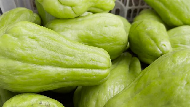 Close-up of fresh chayote leaves, a healthy green vegetable. Vegetables in a basket.