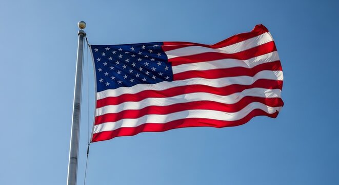 American Flag Waving Proudly Against a Clear Blue Sky.