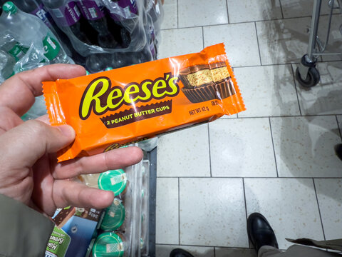 BELGRADE, SERBIA - OCTOBER 25, 2025: Reese's peanut butter cups in a supermarket in Belgrade. Reese's Peanut Butter Cups is an american candy of chocolate and peanut butter produced by Hershey's.