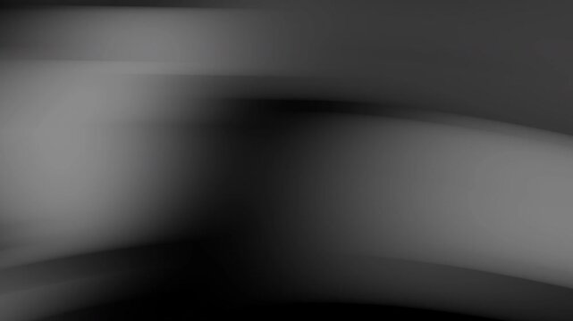 Blurry abstract grayscale composition captures light and shadow. Suitable for backgrounds, design elements, and artistic projects requiring a mysterious atmosphere.